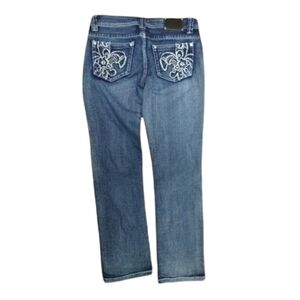 Red Rivet denim jeans with embellished pockets